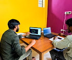 A learner receives guidance during a drafting practice session